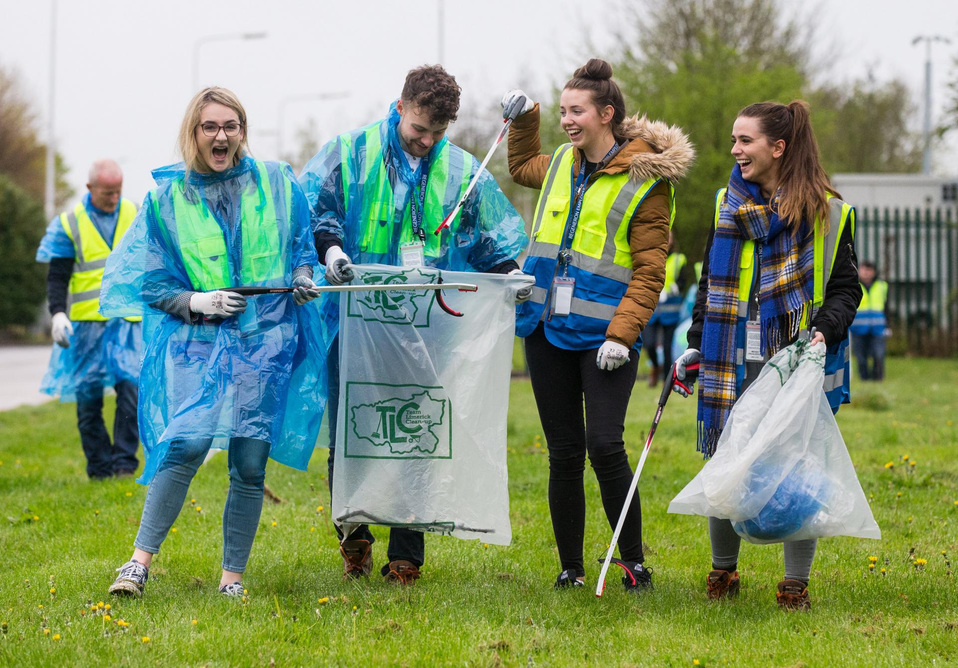 Four young adults clean up
