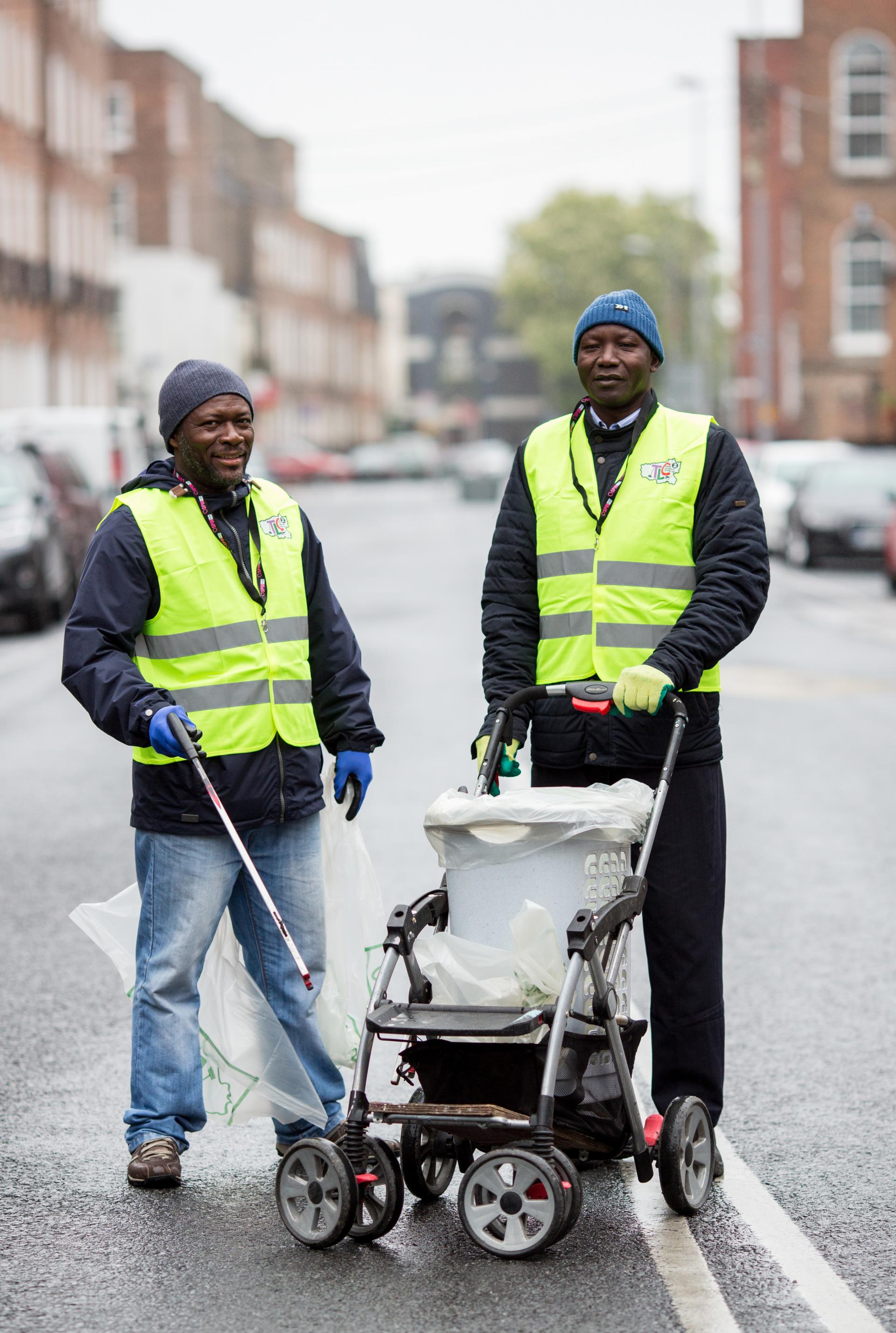 Two volunteers clean up in Pery Square