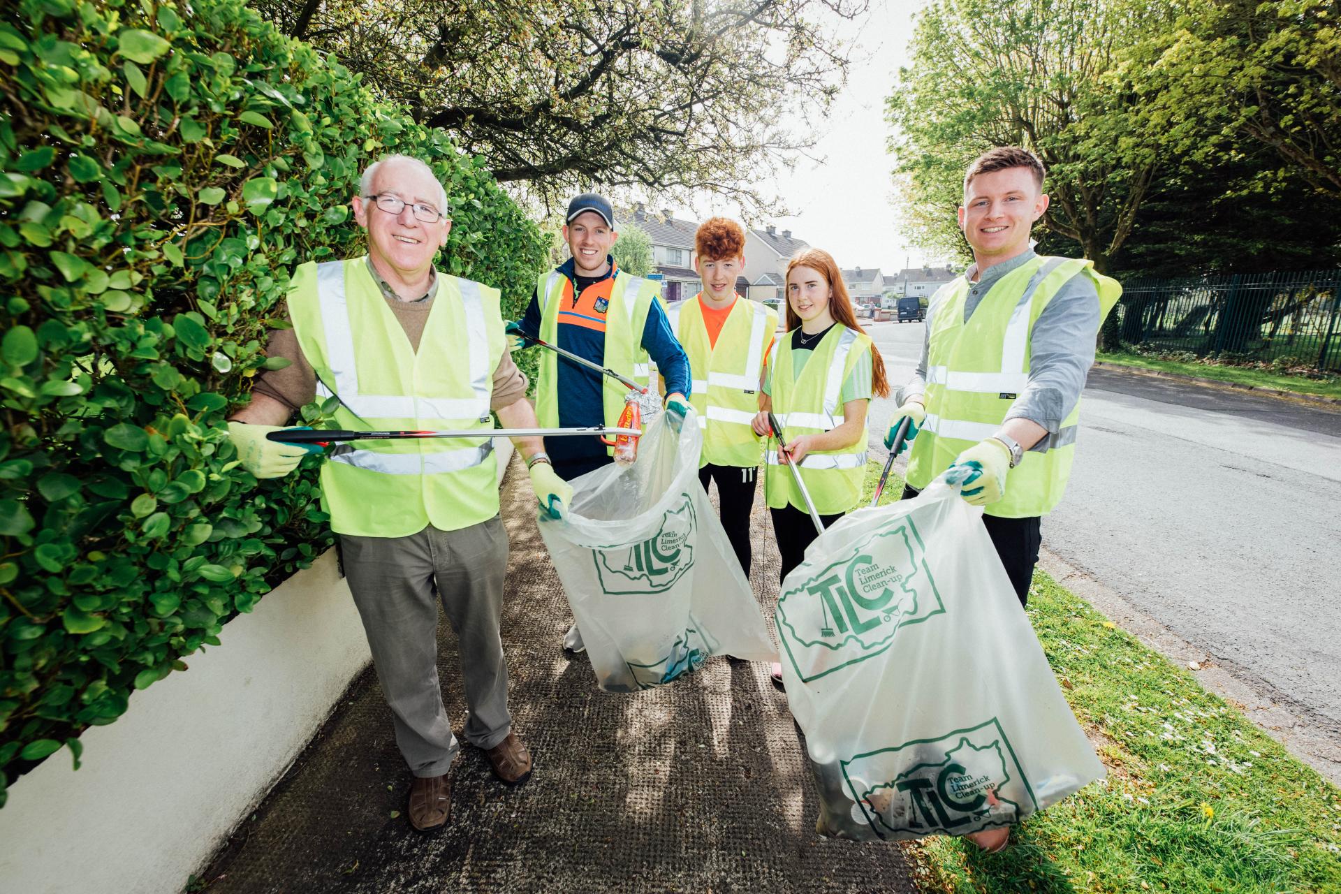 A group tidy up on a sidewalk