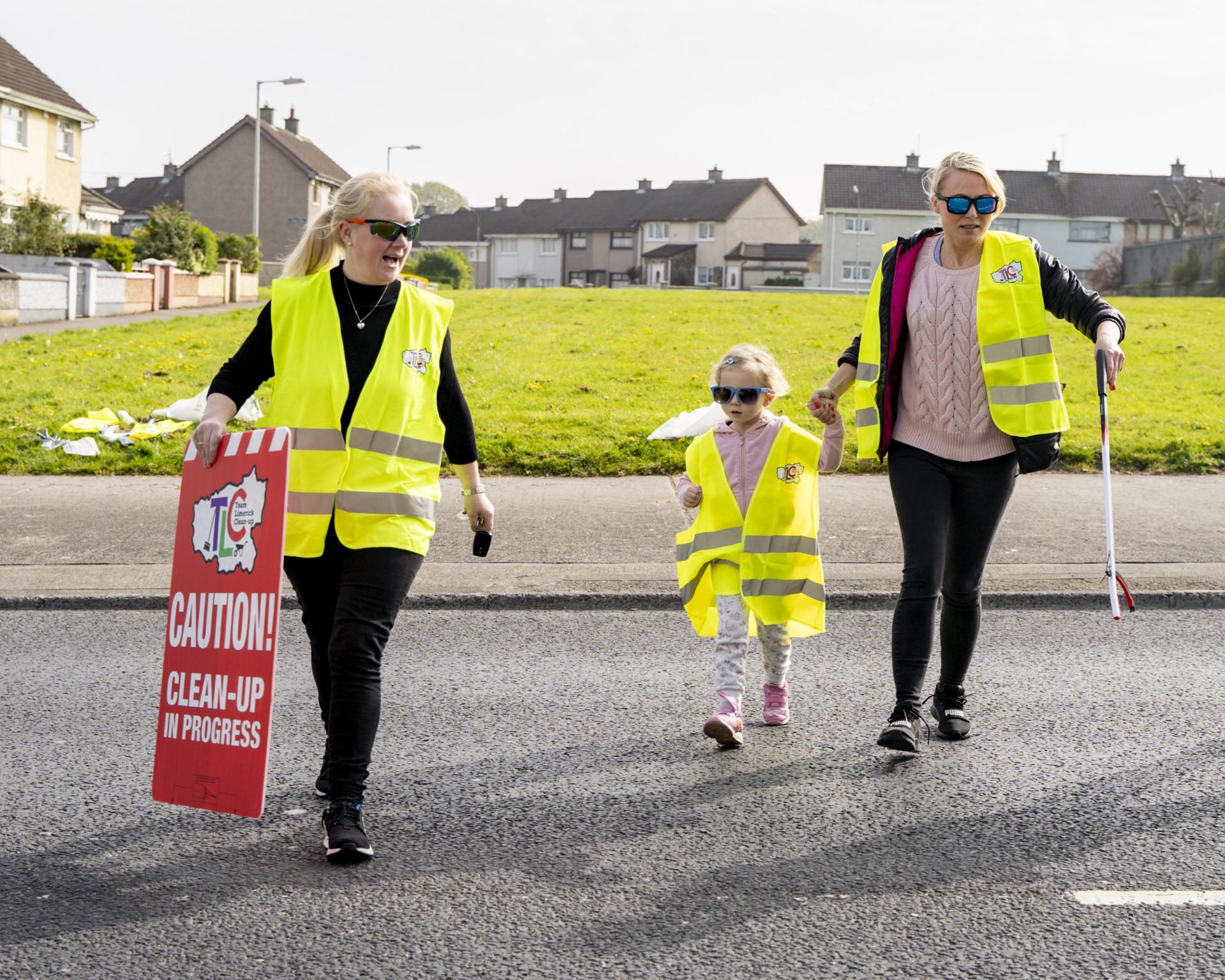 Two women and a child clean up